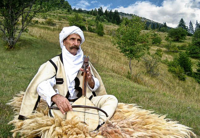 Musician in traditional dress - Albania holidays