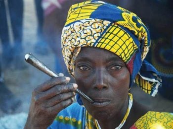 Nguendelengo woman smoking pipe - Angola tours and holidays