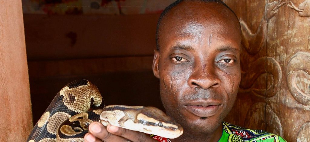 Gold and Magic itinerary - small group tours to Ghana, Togo and Benin - photo of man with snake