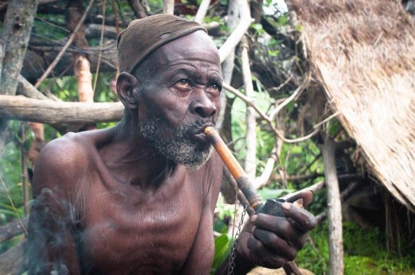 Village elder smoking pipe - Cameroon tour