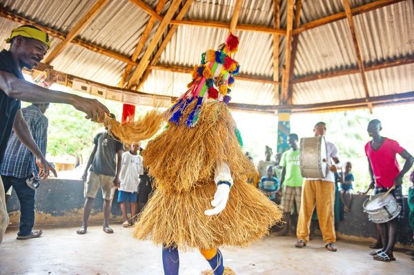 Masked dancer in Sierra Leone - Sierra Leone holidays