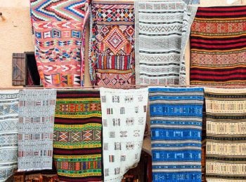 Berber rugs for sale in the market - Algeria holidays