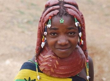 Muila girl with traditional hairstyle and necklace - Angola tours