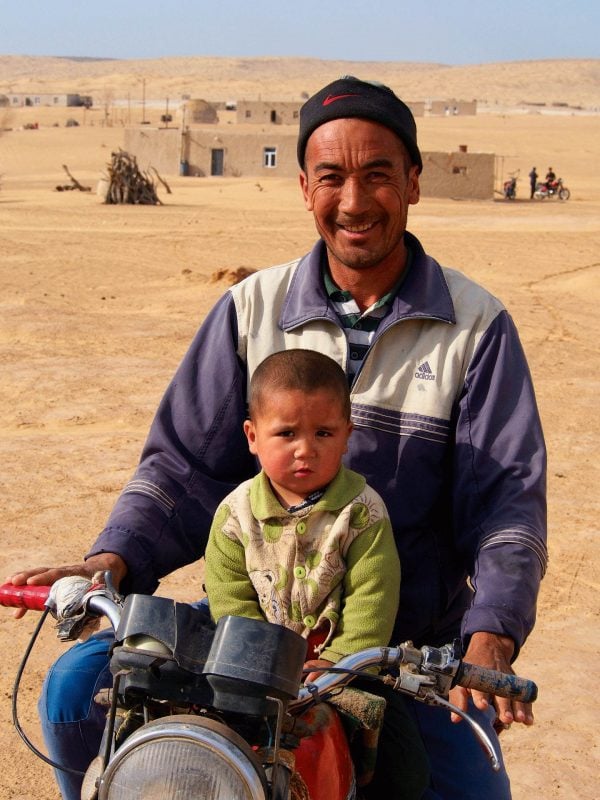 Father and son in the Kyzyl Kum desert - Central Asia holidays
