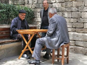Old men playing backgammon in Baku - Azerbaijan holidays
