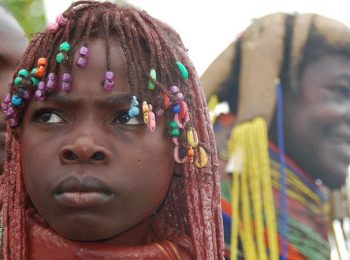 Muila girl with traditional hairstyle and necklace - Angola tours