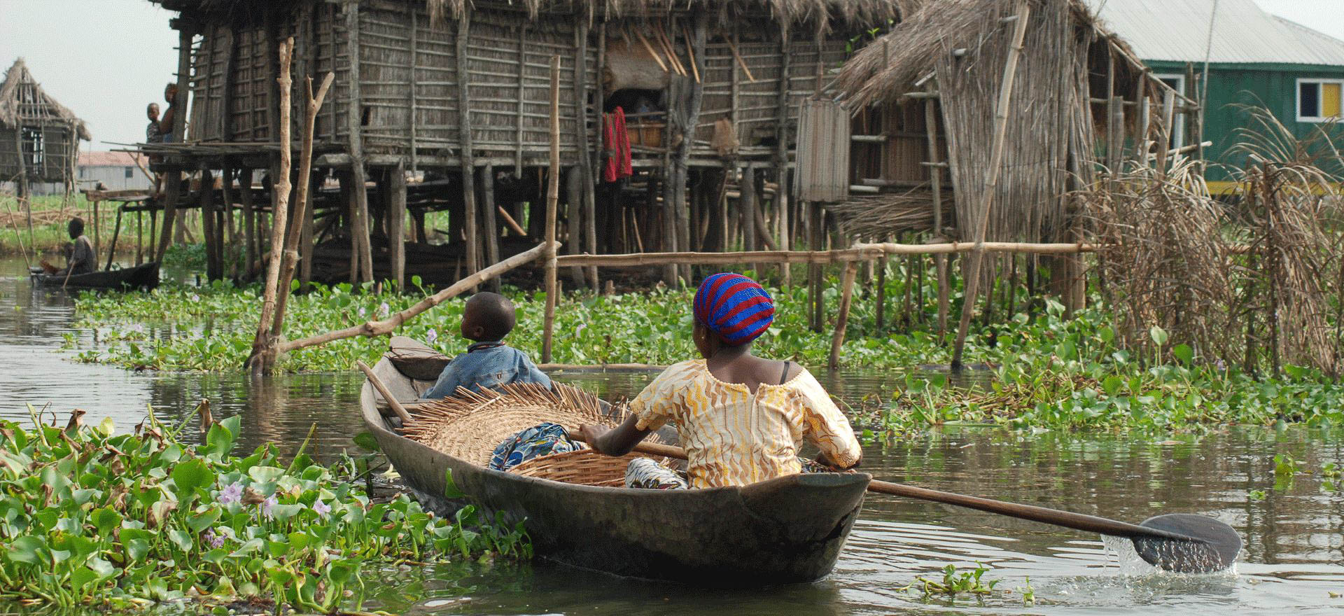 Woman sailing on Lake Nokwe - Benin tours and holidays