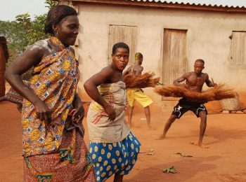 Women dancing at traditional voodoo ceremony - Benin holidays