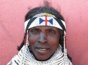 Handa woman with traditional beaded necklace in Hoque market - Angola tours
