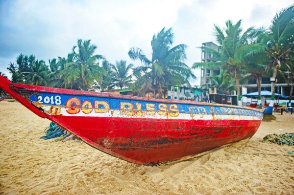 Colourful fishing boat on the beach - Sierra Leone tours