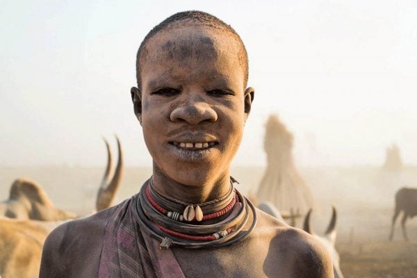 Mundari man with ash coated face - South Sudan tour