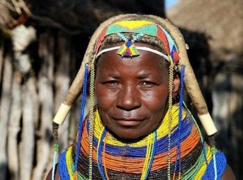 Muila woman with traditional hairstyle and necklace - Angola tours
