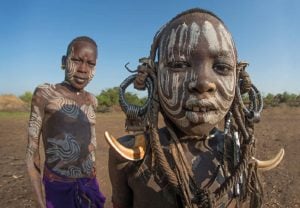 Two boys from the Omo Valley in traditional clothing - Best of Ethiopia itinerary