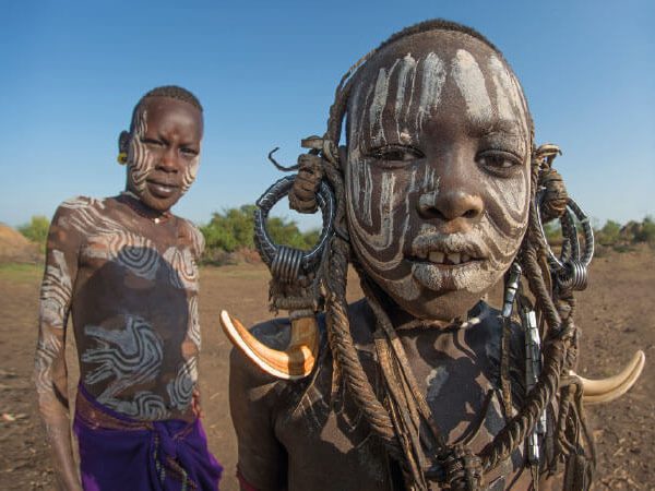 Two boys from the Omo Valley in traditional clothing - Best of Ethiopia itinerary