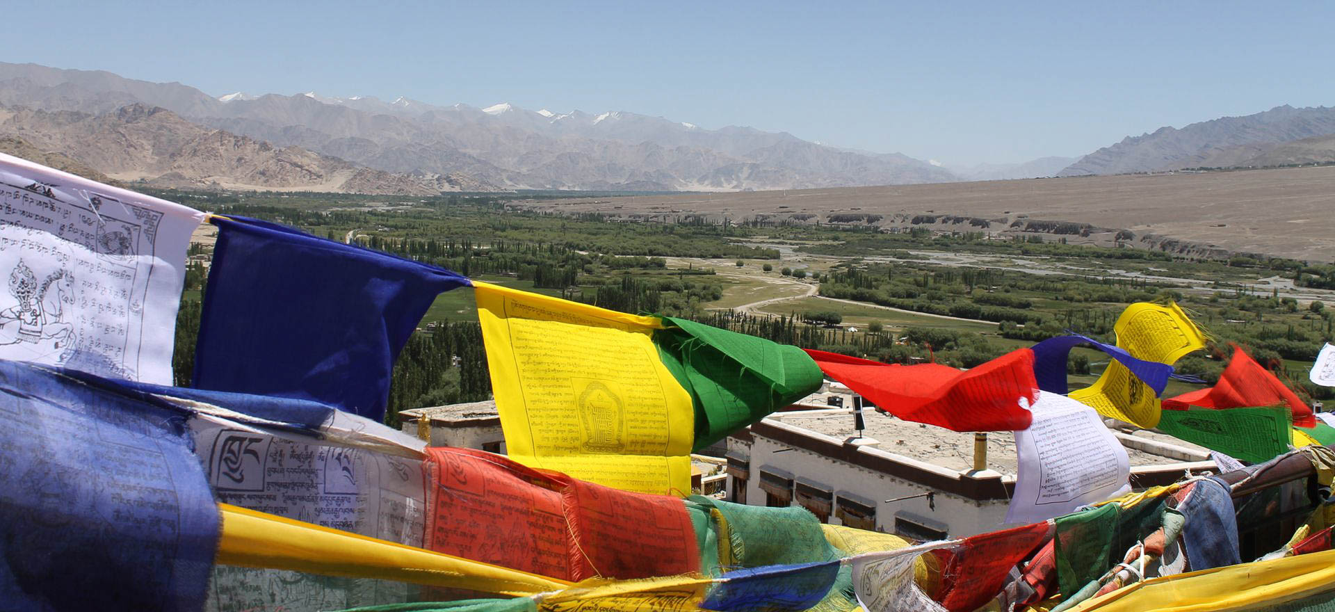 Prayer flags in the Himalaya Mountains - India Holidays and Tours
