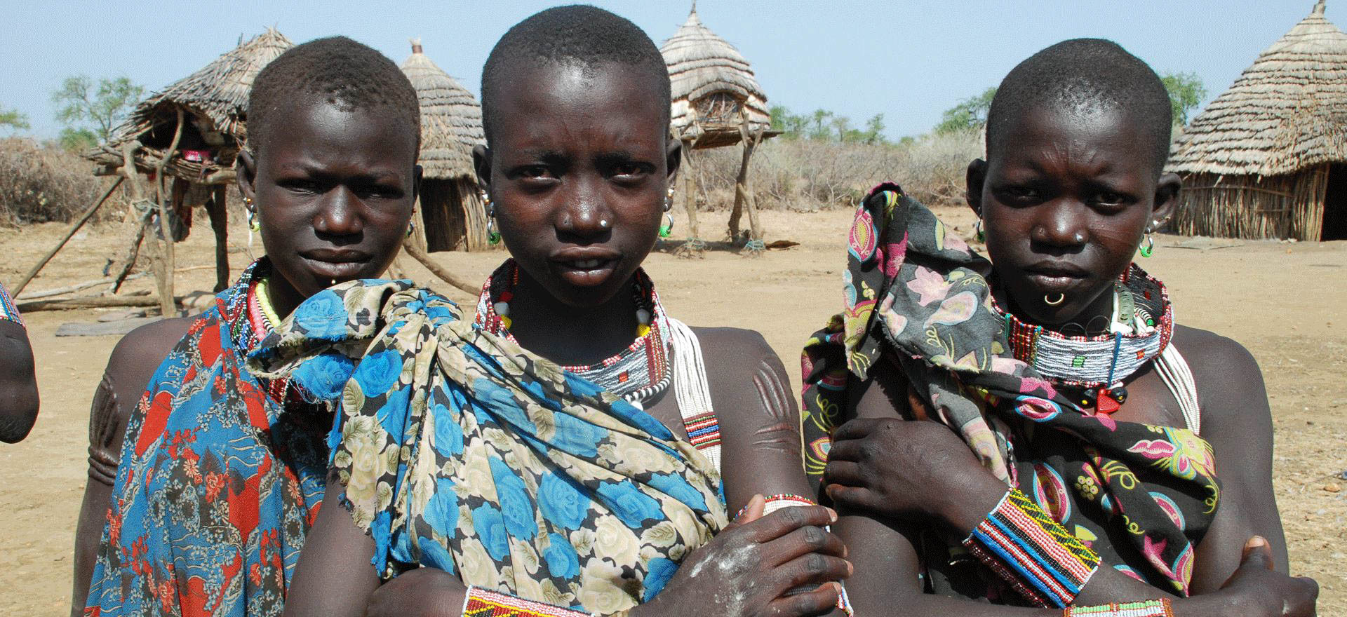 Toposa girls in traditional village - South Sudan Holidays and Tours