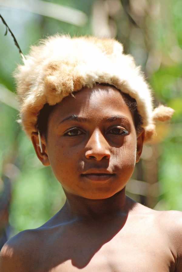 Boy in possum skin hat - Papua New Guinea