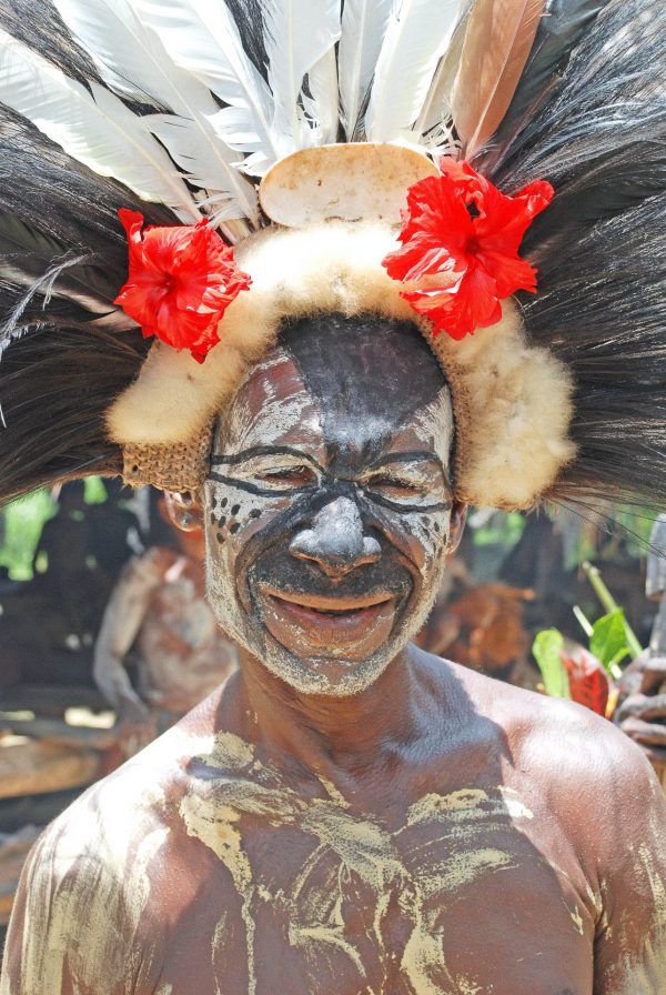 Man with painted face - Papua New Guinea tour