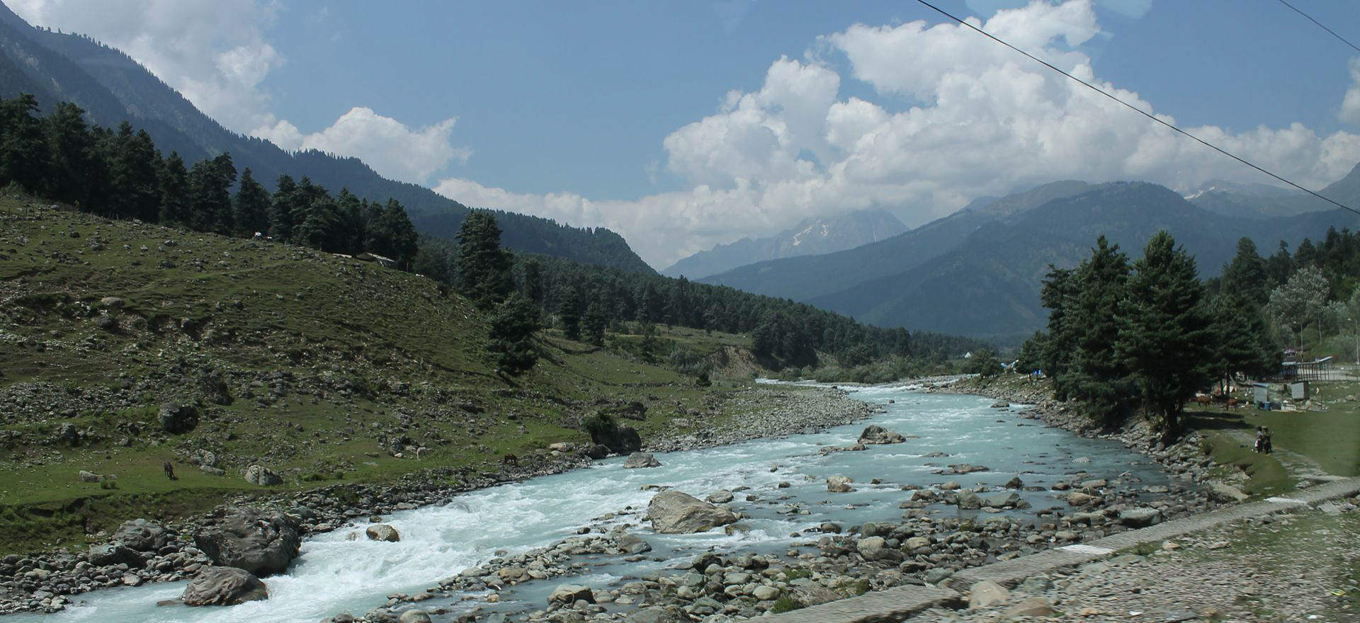 River running through the Himalayas - India Holidays and Tours