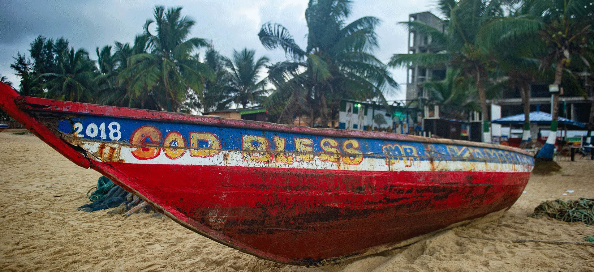 Sierra Leone Holidays and Tours - Decorated fishing boat on beach