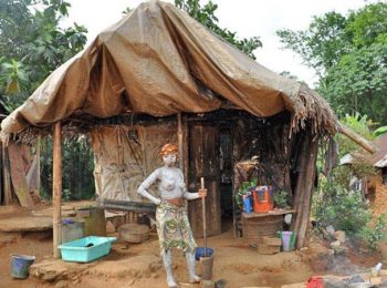 Bassa woman with white clay on body - Liberia Holidays and Tours