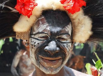 Papua New Guinea Holidays and Tours - Man with painted face on the Sepik River