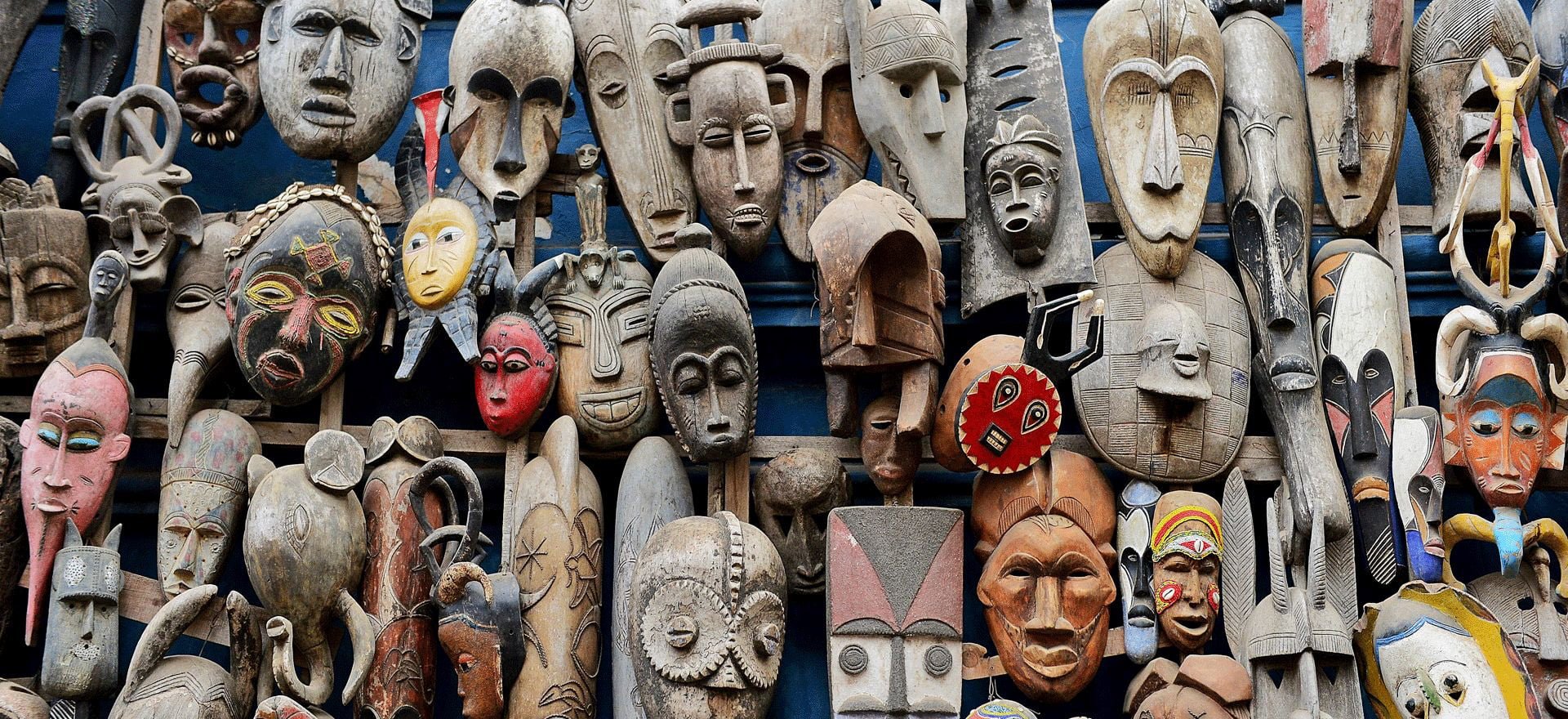 Senegal Uncovered - photo of carved wooden masks - West Africa holidays