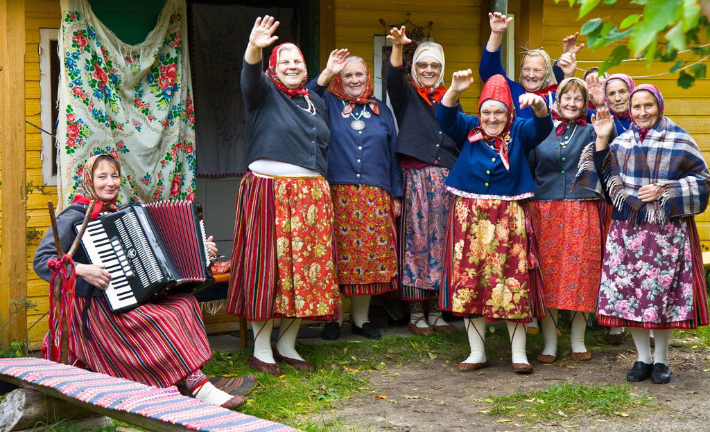 Local women welcoming visitors on a remote island holiday - Kihnu