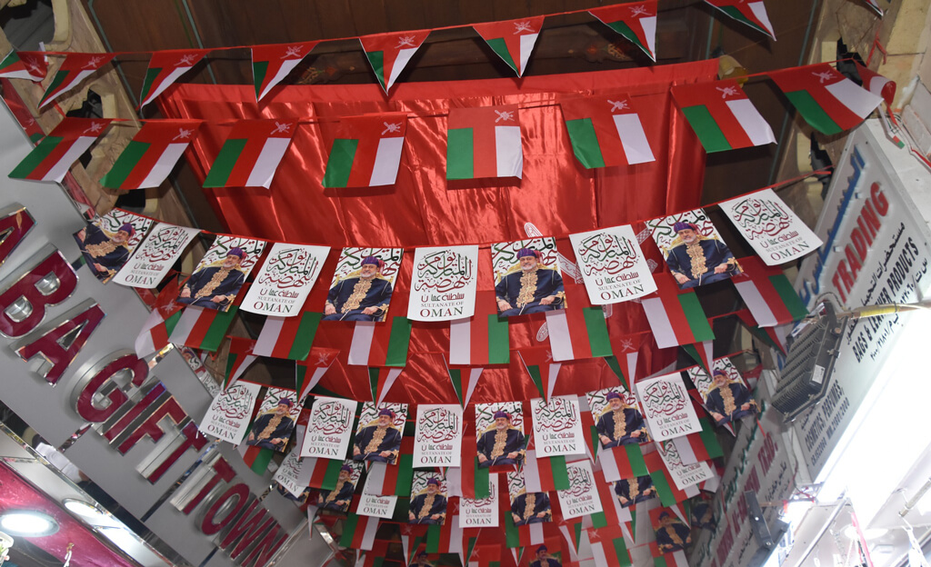 Photos of Oman, flags of the Sultan of Oman hanging up in Muttrah souq
