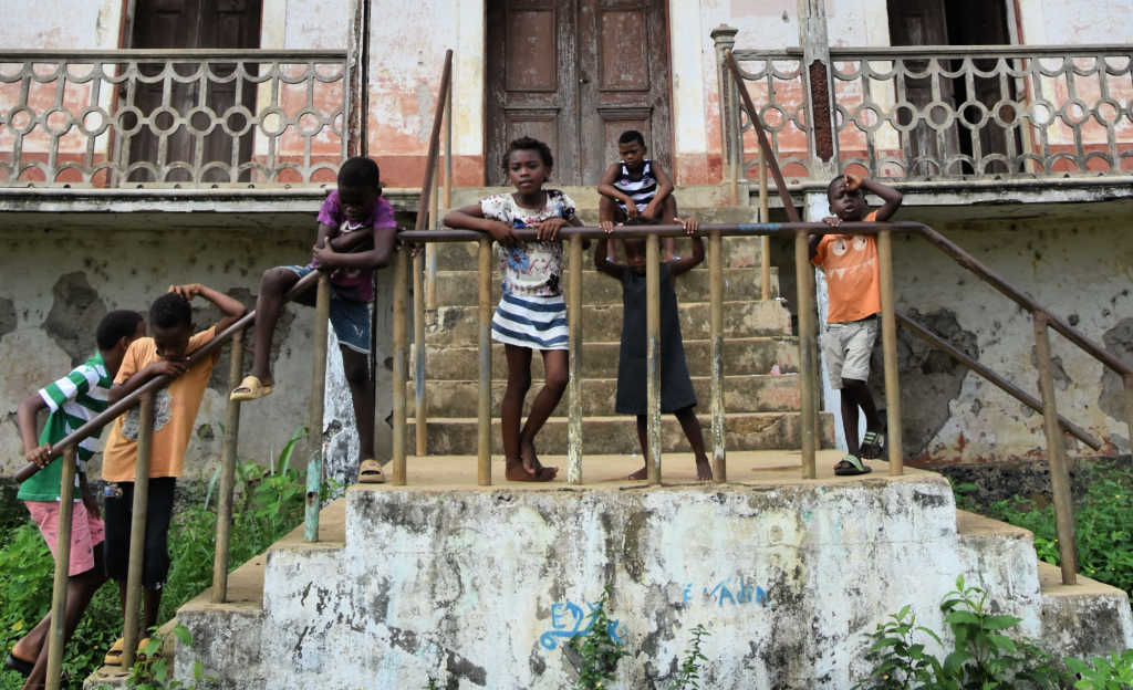 Kids on playing on old colonial buildings in Sao Tomé