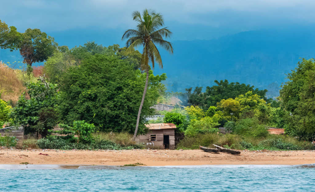 Fishermans dug out canoes on beach on Sao Tomé island