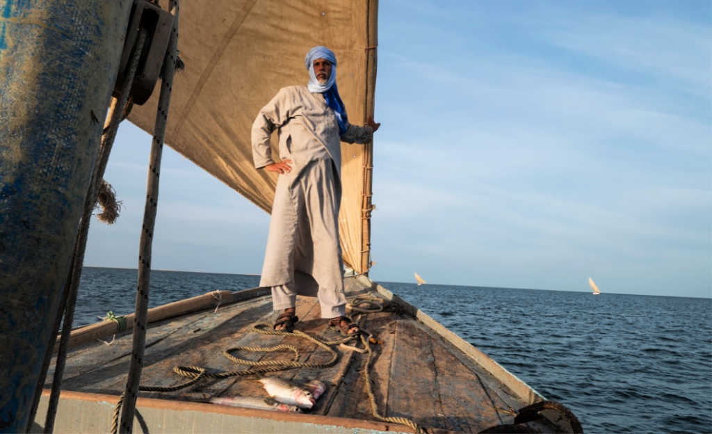 Man fishing on a traditional boat near Nouakchott, Mauritania 