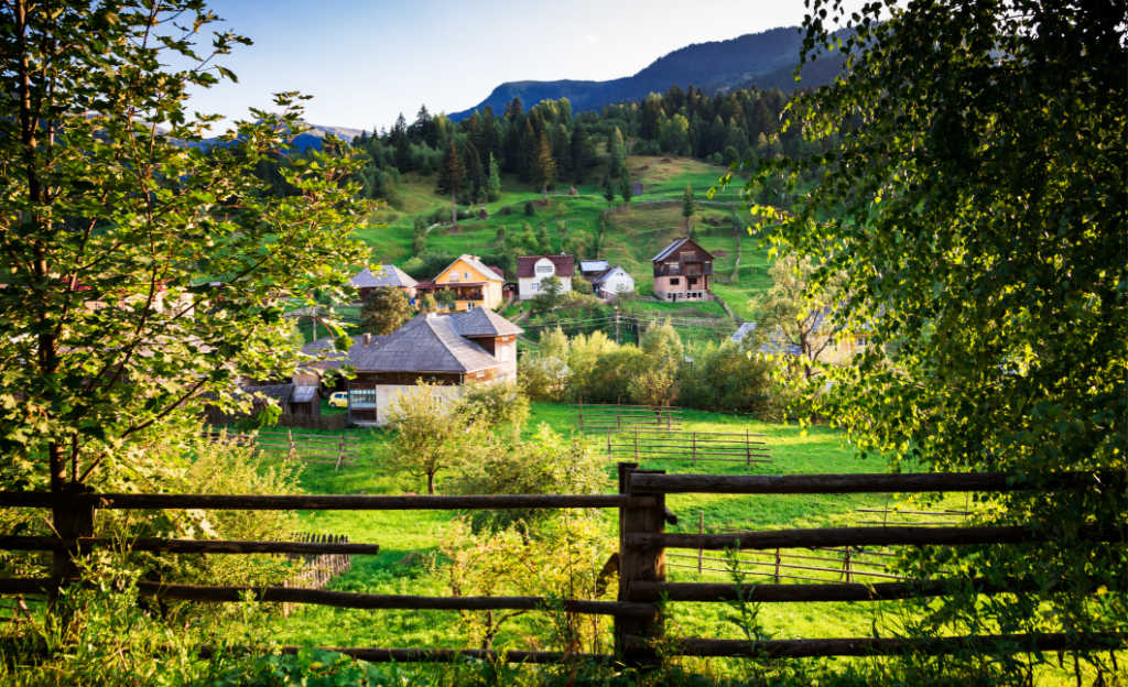 See lush agricultural landscapes in Maramures county when visiting Romania
