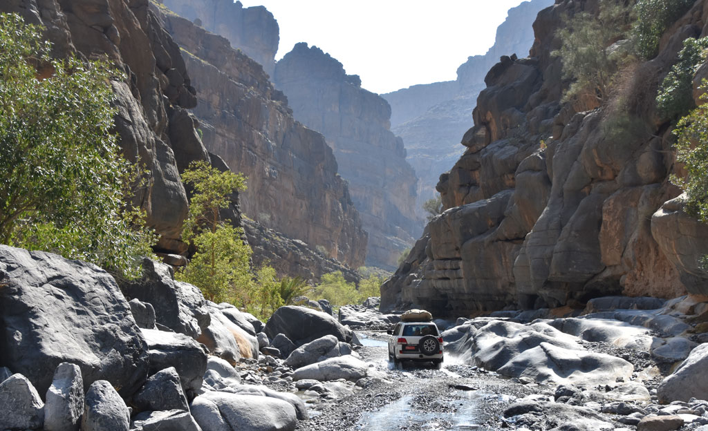 Oman, driving through a steep-sided gorge 